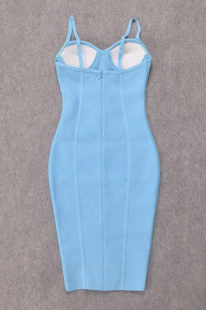 Woman wearing a figure flattering Abi Bandage Dress - Sky Blue Bodycon Collection