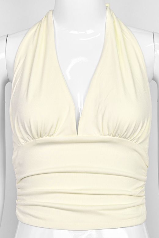 Woman wearing a figure flattering Aby Halter Top - Butter Yellow BODYCON COLLECTION Pty Ltd