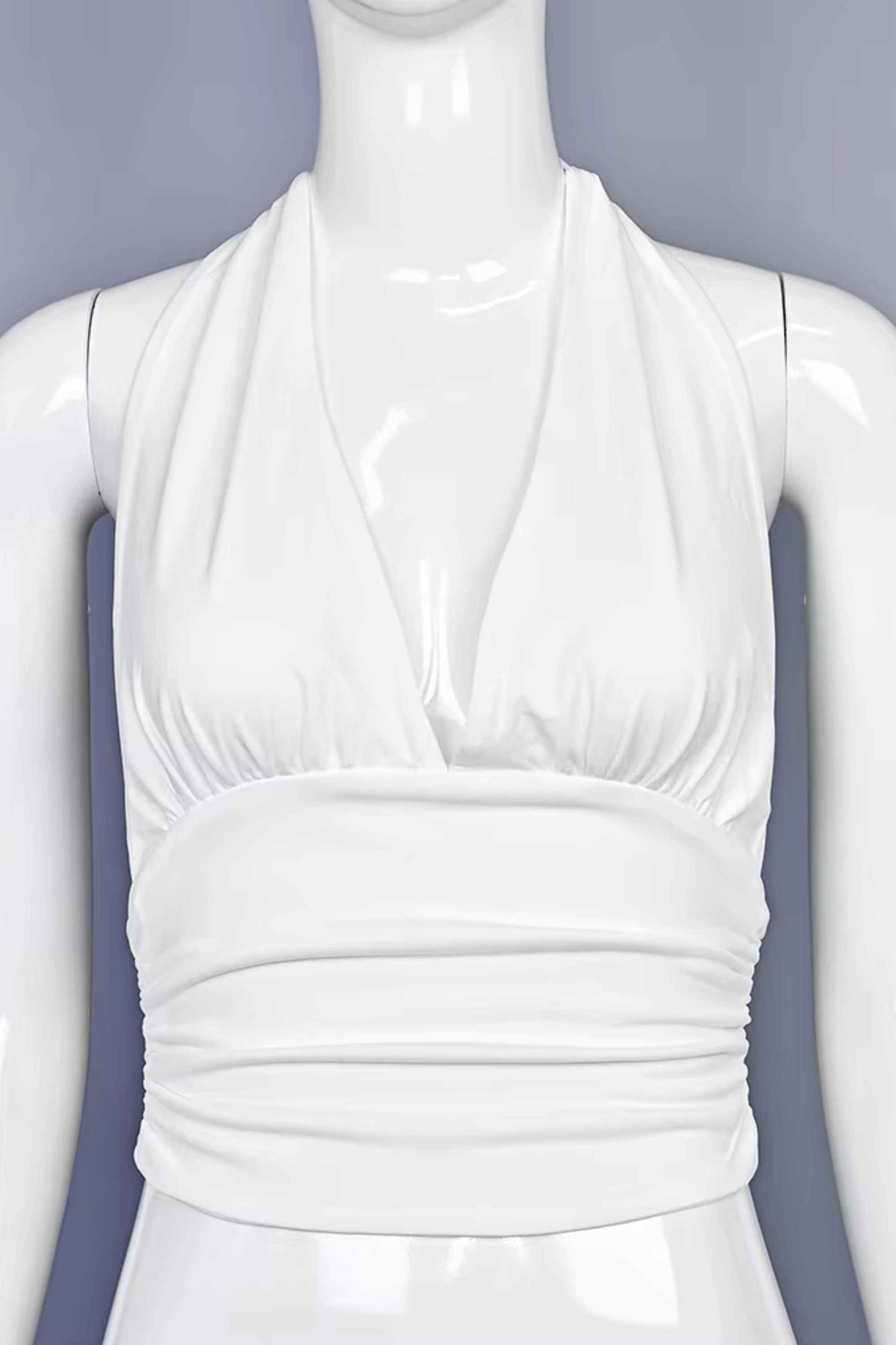Woman wearing a figure flattering Aby Halter Top - White Pearl BODYCON COLLECTION Pty Ltd
