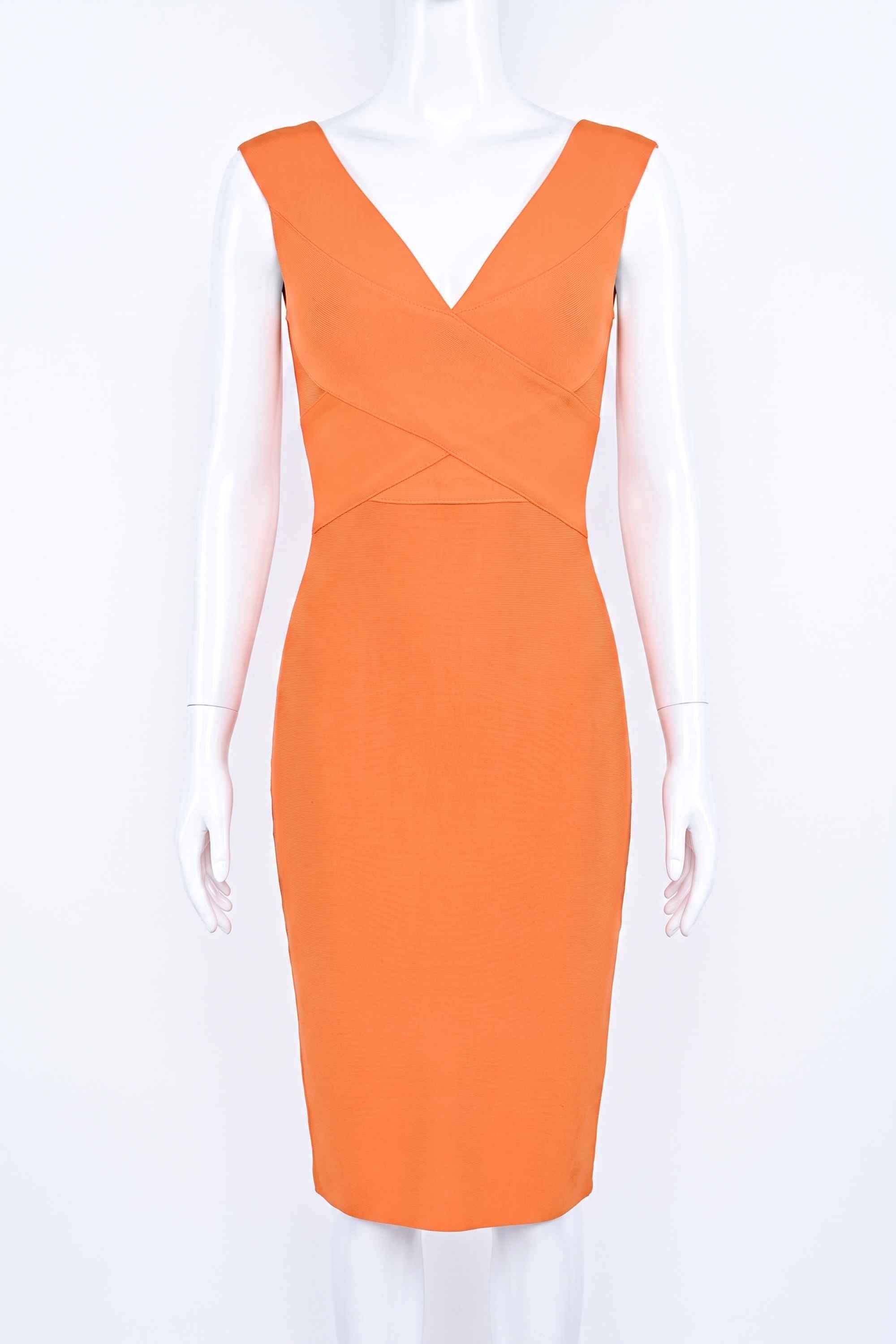 Woman wearing a figure flattering Ash Bandage Dress - Apricot Orange Bodycon Collection