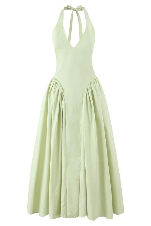 Woman wearing a figure flattering Austen Bodycon Midi Dress - Pistachio Green BODYCON COLLECTION