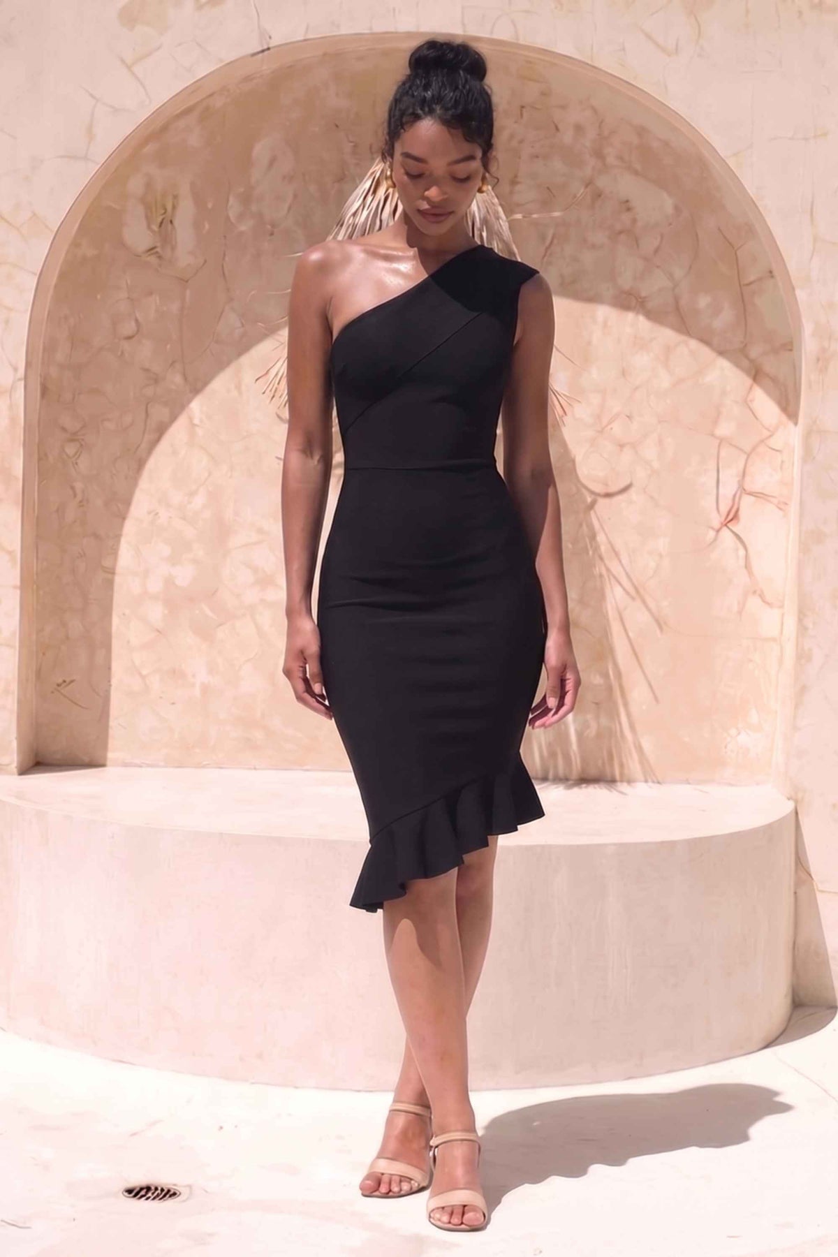 Woman wearing a figure flattering Avery Bandage Dress - Classic Black BODYCON COLLECTION