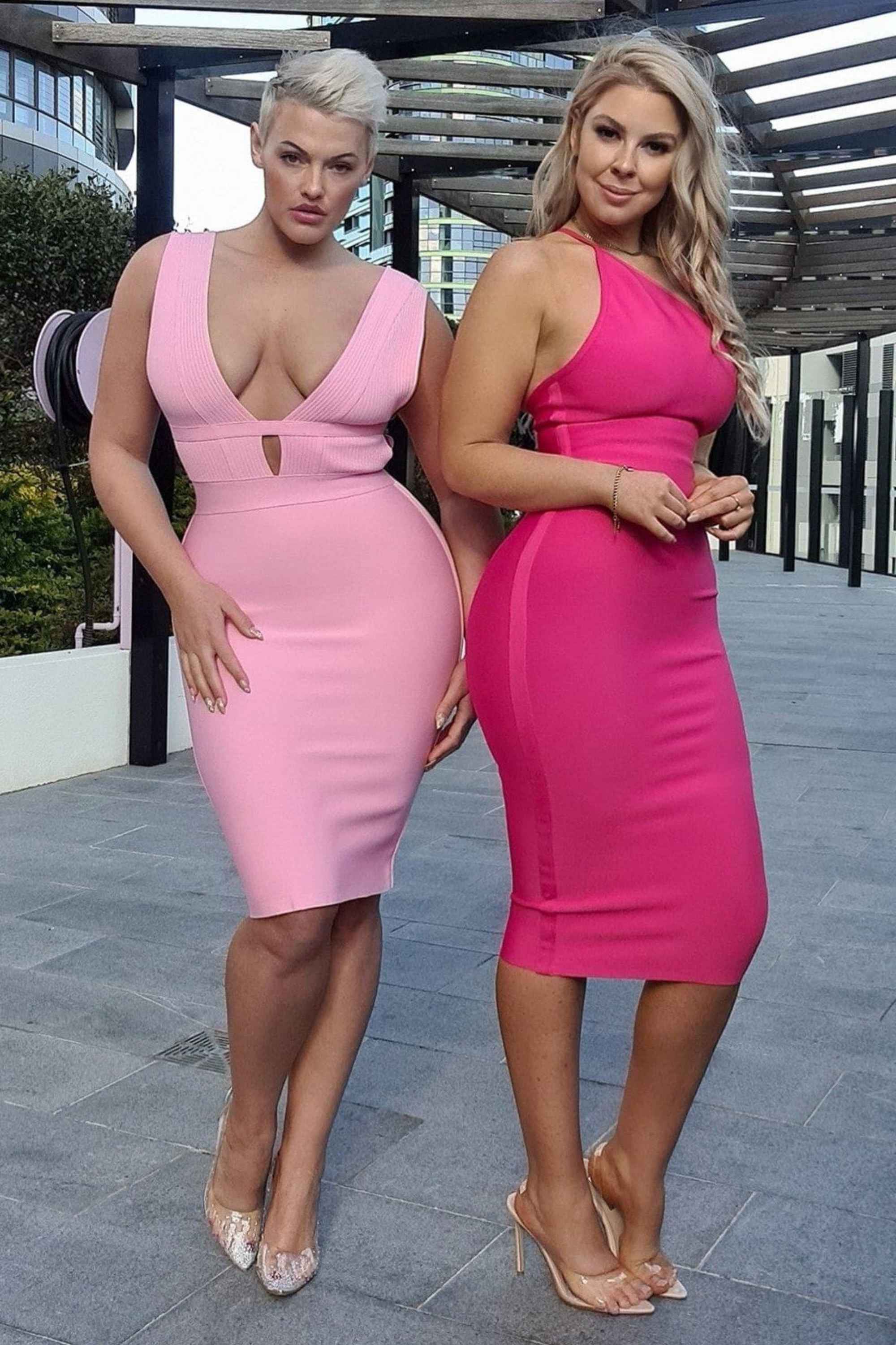 Woman wearing a figure flattering Bay Bandage Dress - Blush Pink Bodycon Collection