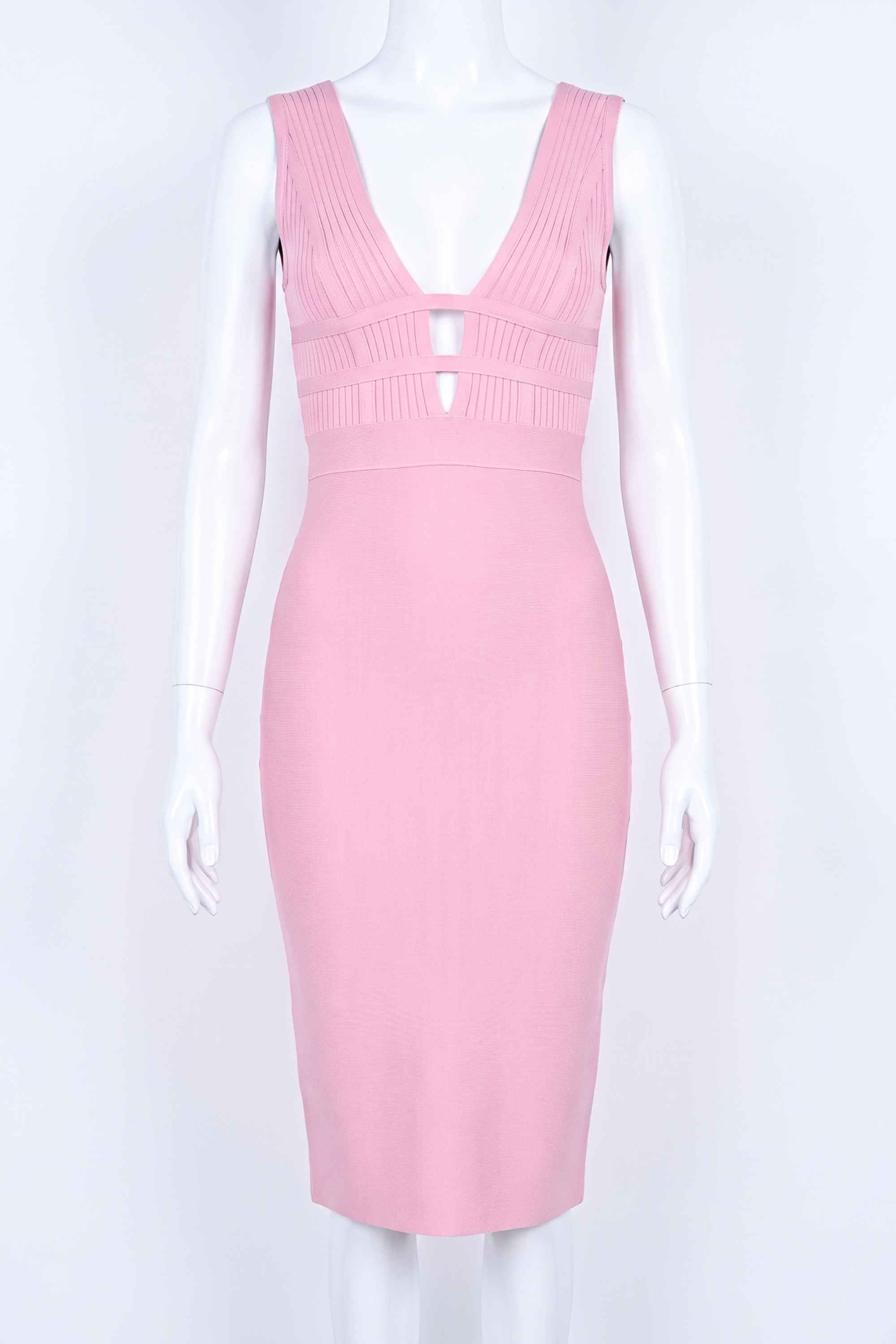Woman wearing a figure flattering Bay Bandage Dress - Blush Pink Bodycon Collection