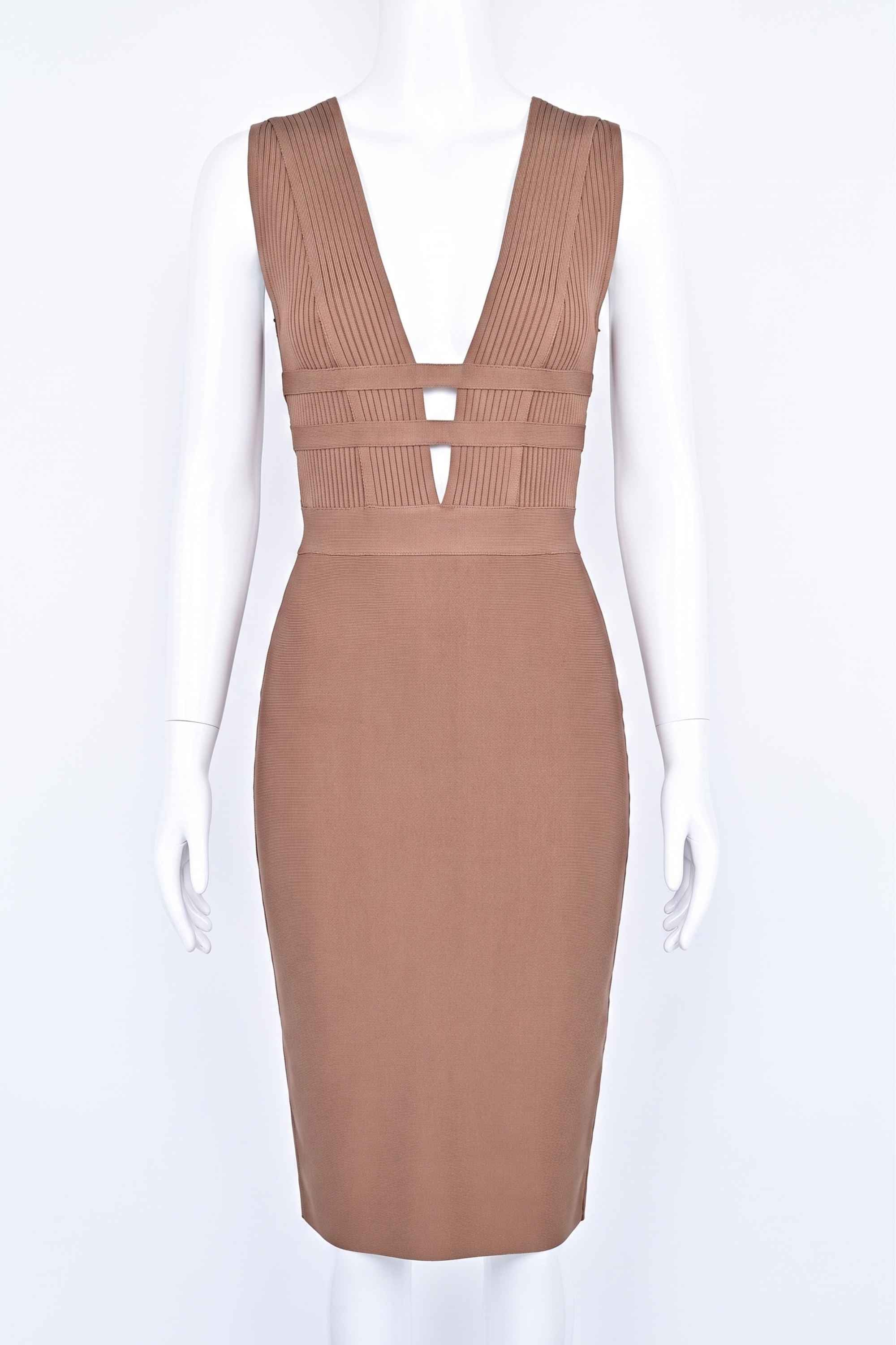Woman wearing a figure flattering Bay Bandage Dress - Nude Bodycon Collection