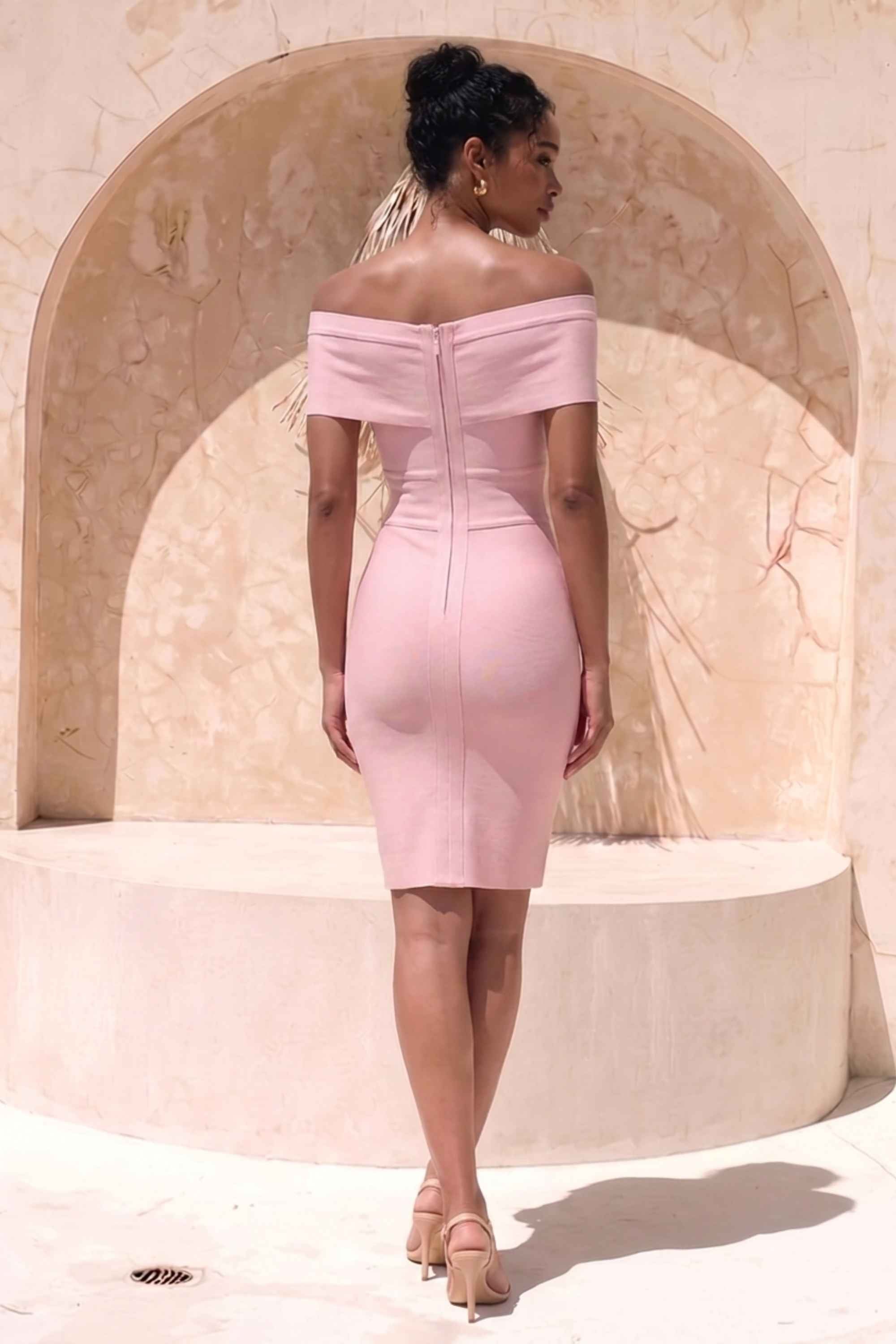 Woman wearing a figure flattering Bea Bandage Dress - Cream Bodycon Collection