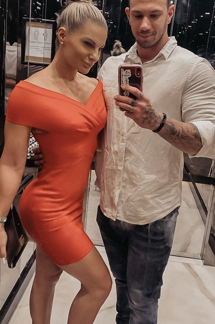 Woman wearing a figure flattering Bea Bandage Dress - Lipstick Red Bodycon Collection