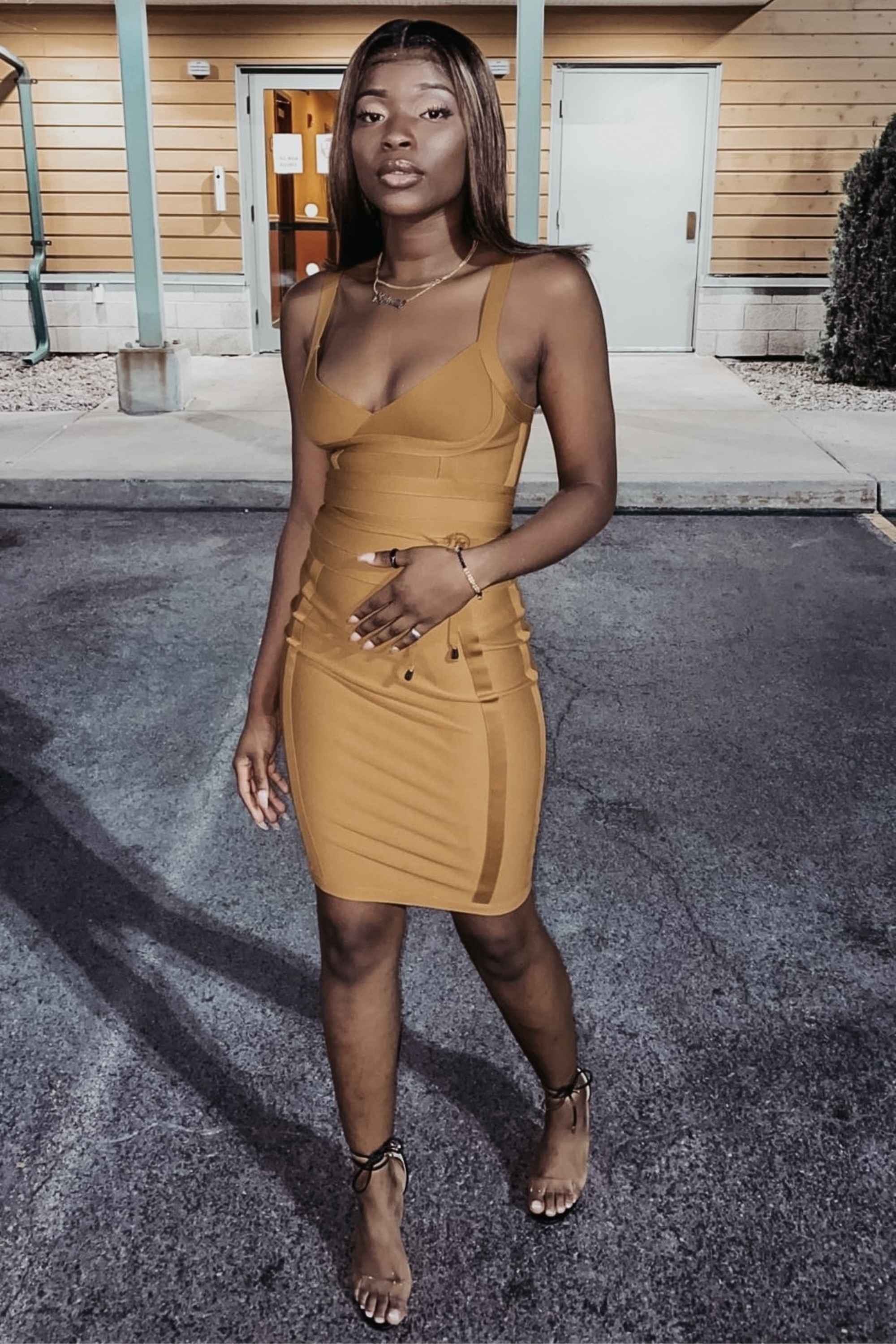 Woman wearing a figure flattering Bek Bandage Dress - Mustard Yellow Bodycon Collection