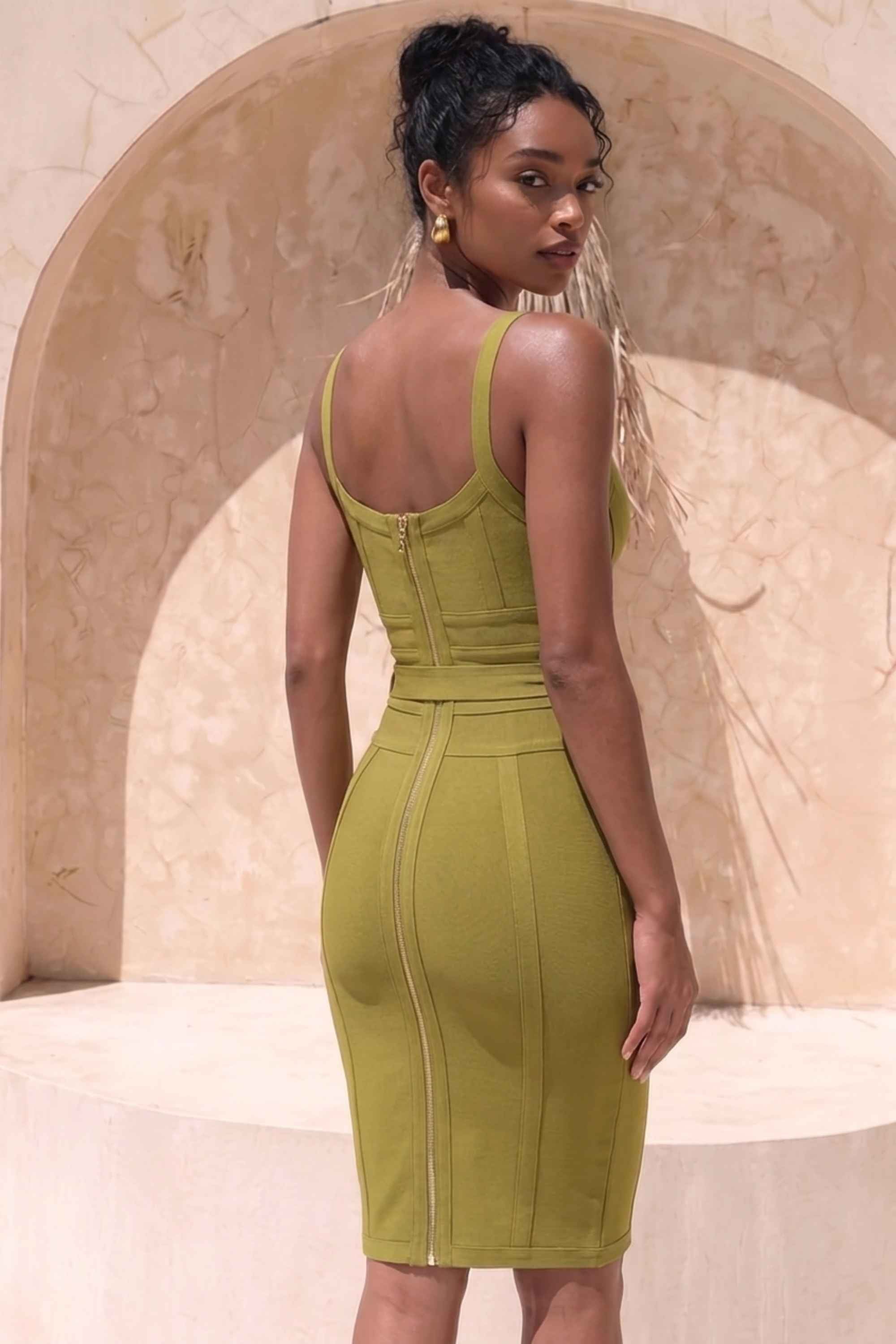 Woman wearing a figure flattering Bek Bandage Dress - Olive Green Bodycon Collection