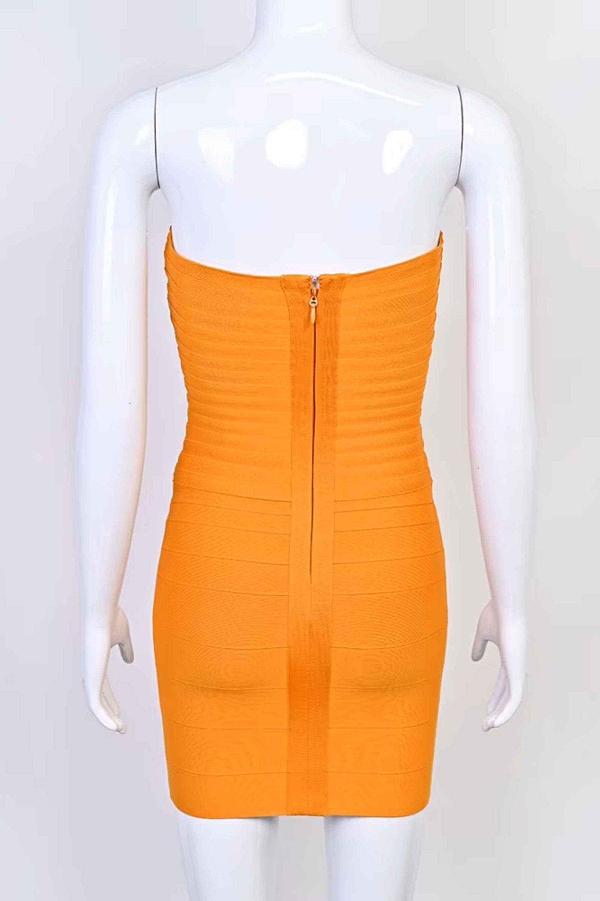 Woman wearing a figure flattering Belle Bandage Mini Dress - Apricot Orange BODYCON COLLECTION Pty Ltd