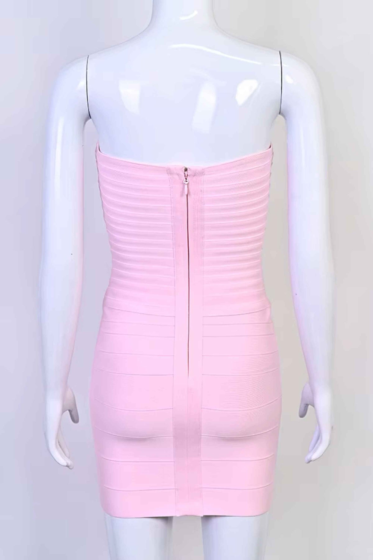 Woman wearing a figure flattering Belle Bandage Mini Dress - Dusty Pink BODYCON COLLECTION Pty Ltd
