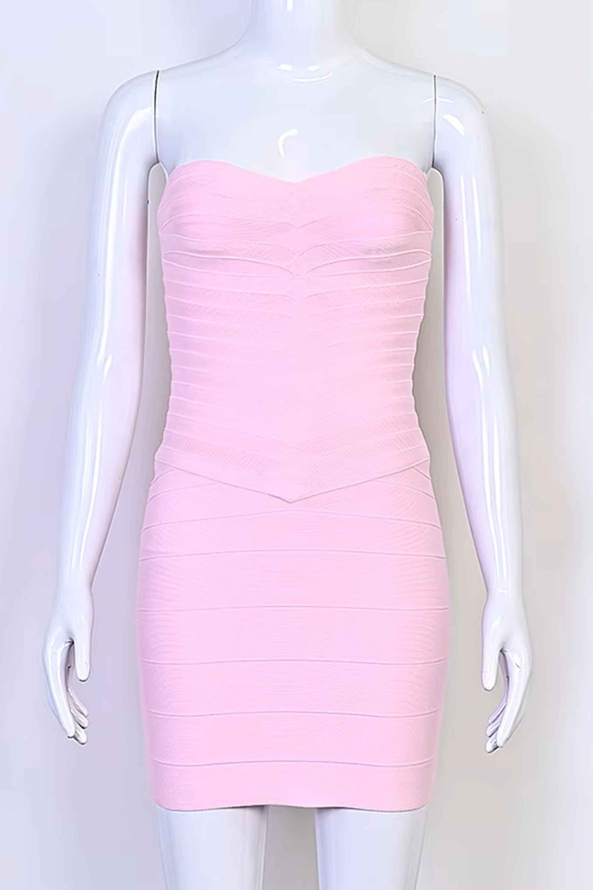 Woman wearing a figure flattering Belle Bandage Mini Dress - Dusty Pink BODYCON COLLECTION Pty Ltd
