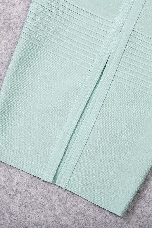 Woman wearing a figure flattering Billie Bandage Midi Dress - Mint Green Bodycon Collection