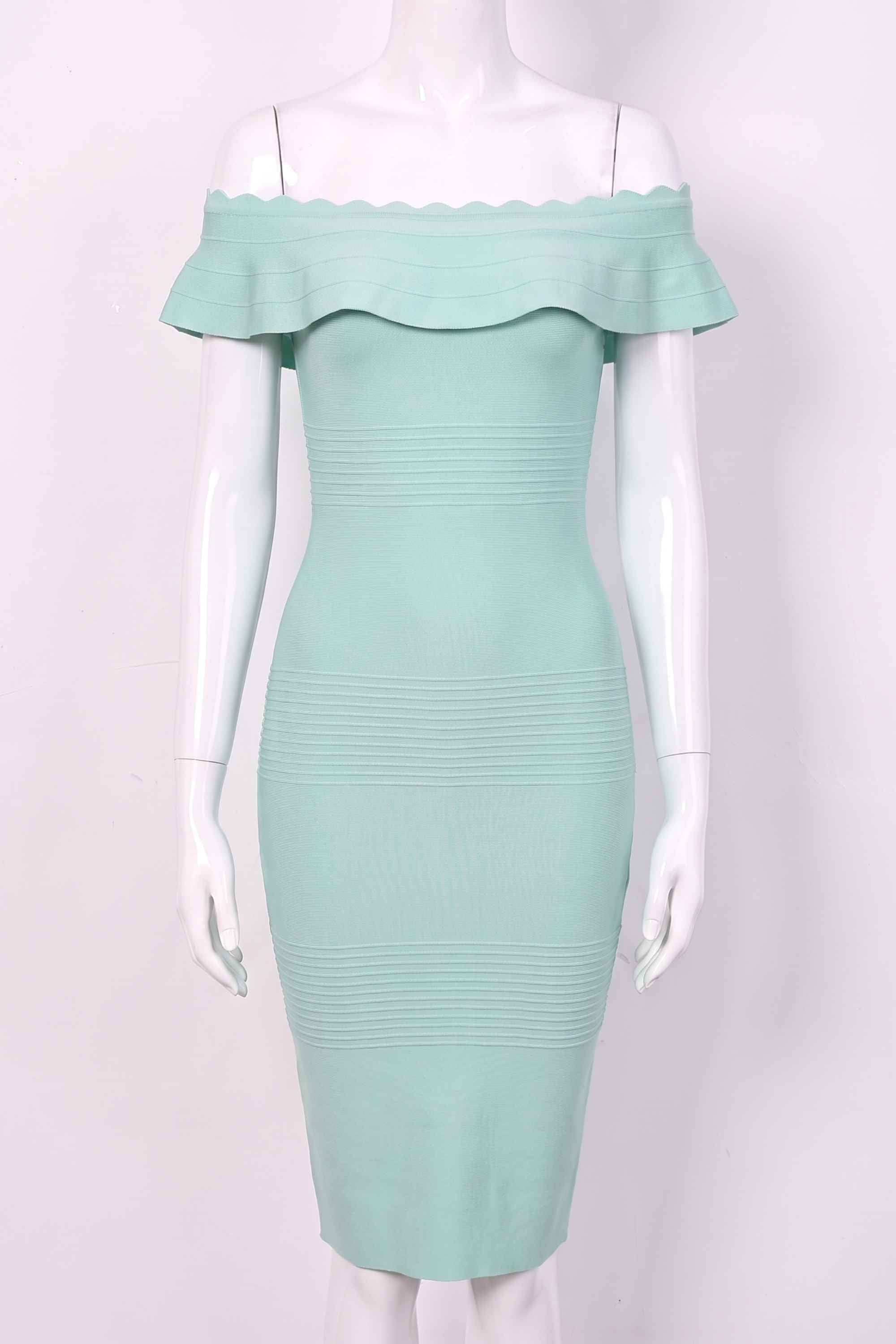 Woman wearing a figure flattering Billie Bandage Midi Dress - Mint Green Bodycon Collection