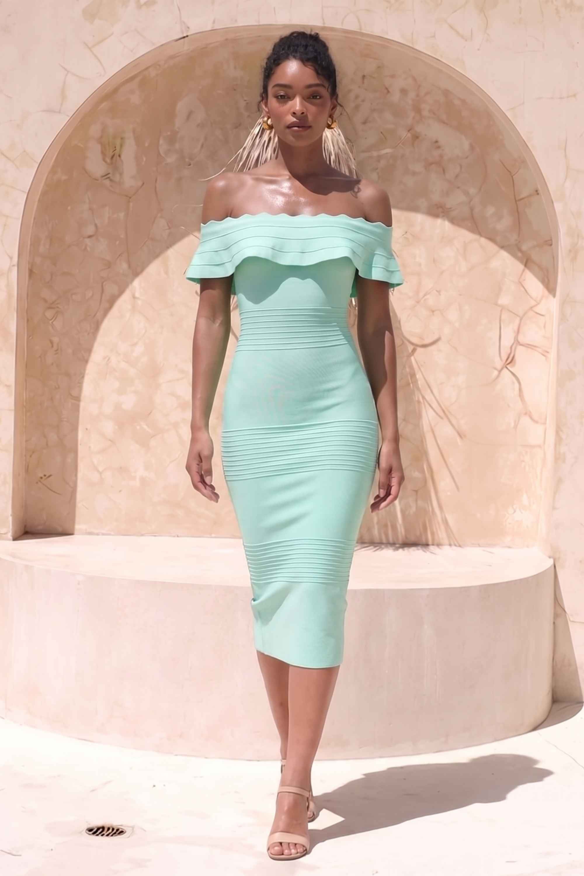 Woman wearing a figure flattering Billie Bandage Midi Dress - Mint Green Bodycon Collection