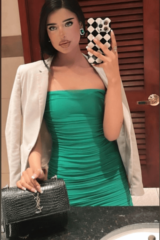 Woman wearing a figure flattering Cassie Bodycon Wrap Mini Dress - Pearl White BODYCON COLLECTION