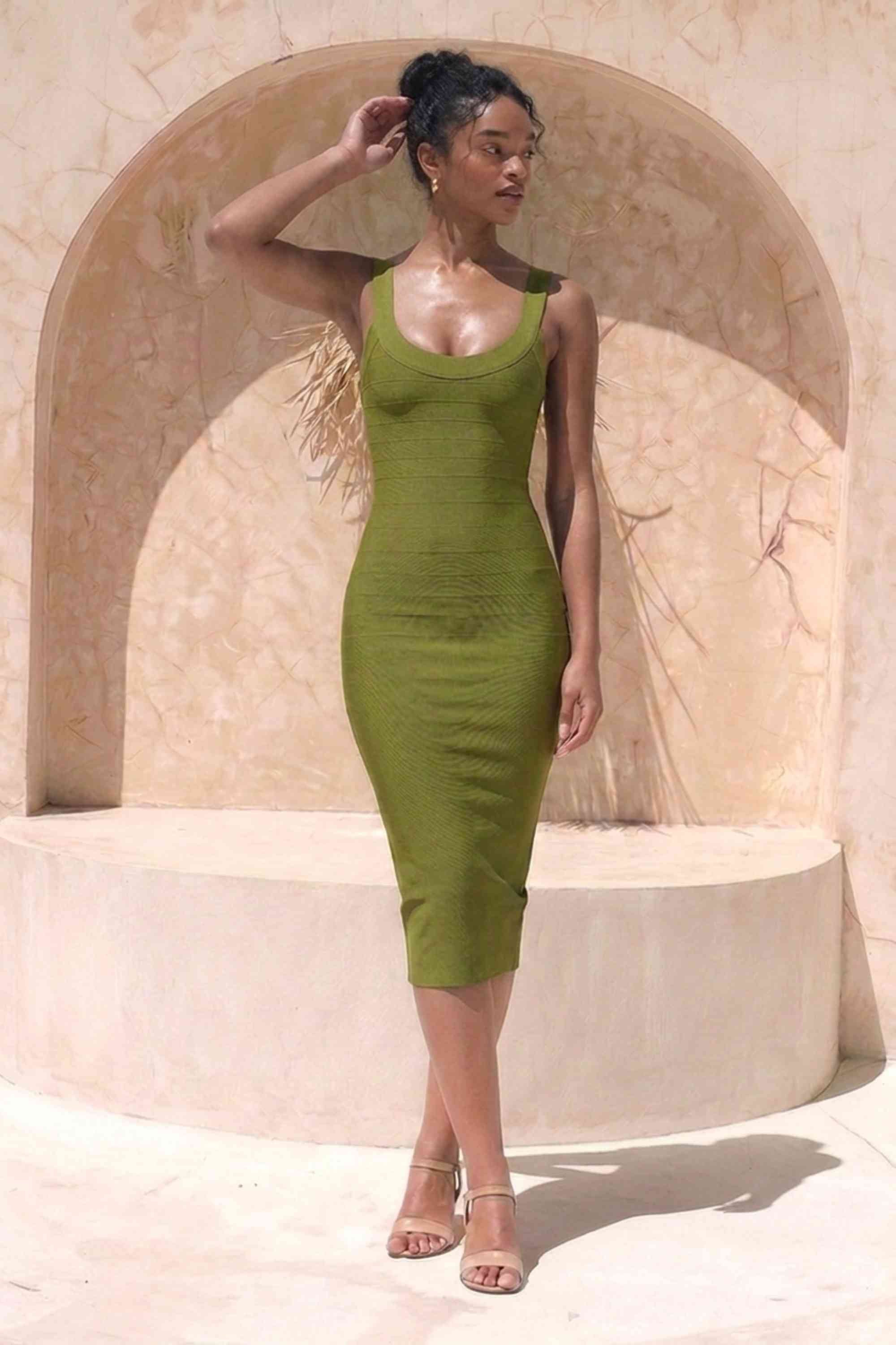 Woman wearing a figure flattering Cindy Bandage Midi Dress - Army Green BODYCON COLLECTION Pty Ltd
