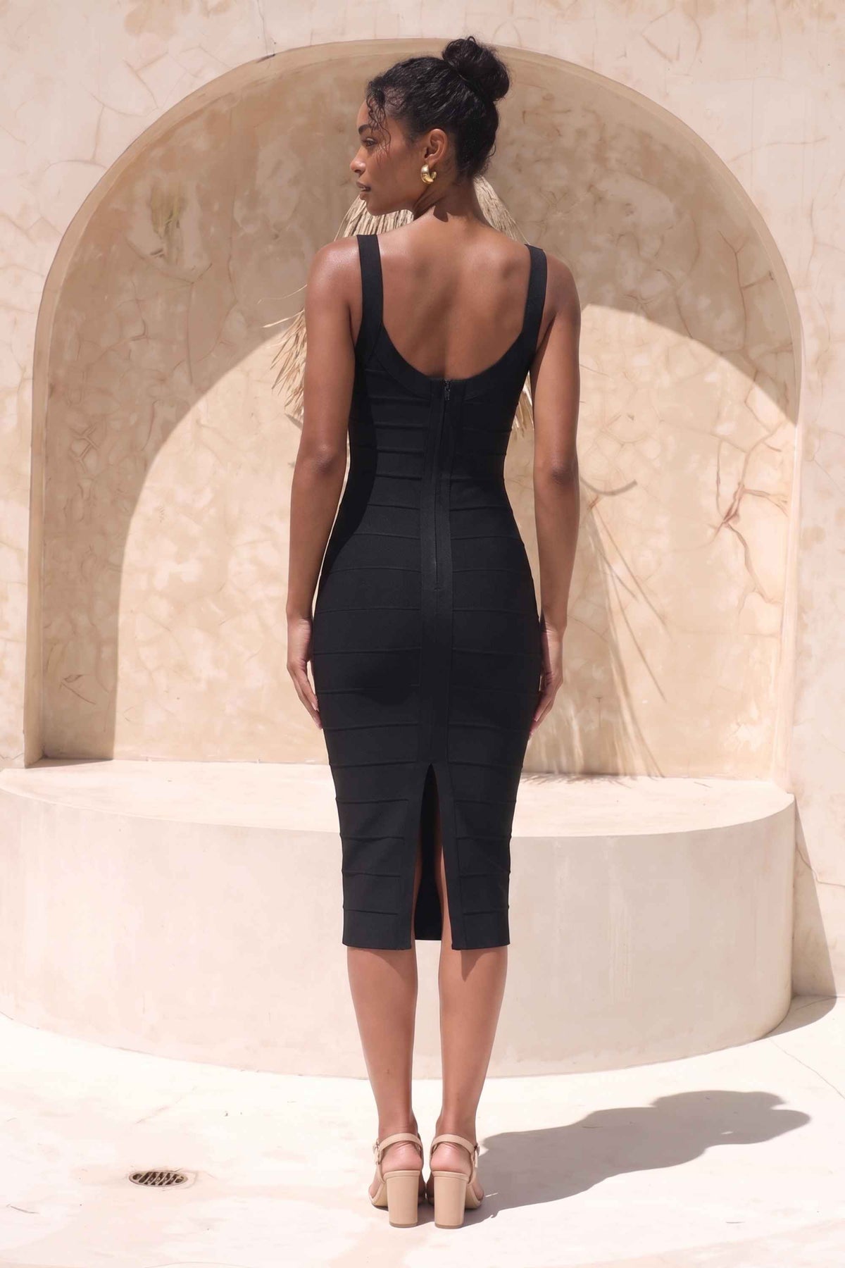 Woman wearing a figure flattering Cindy Bandage Midi Dress - Classic Black BODYCON COLLECTION Pty Ltd