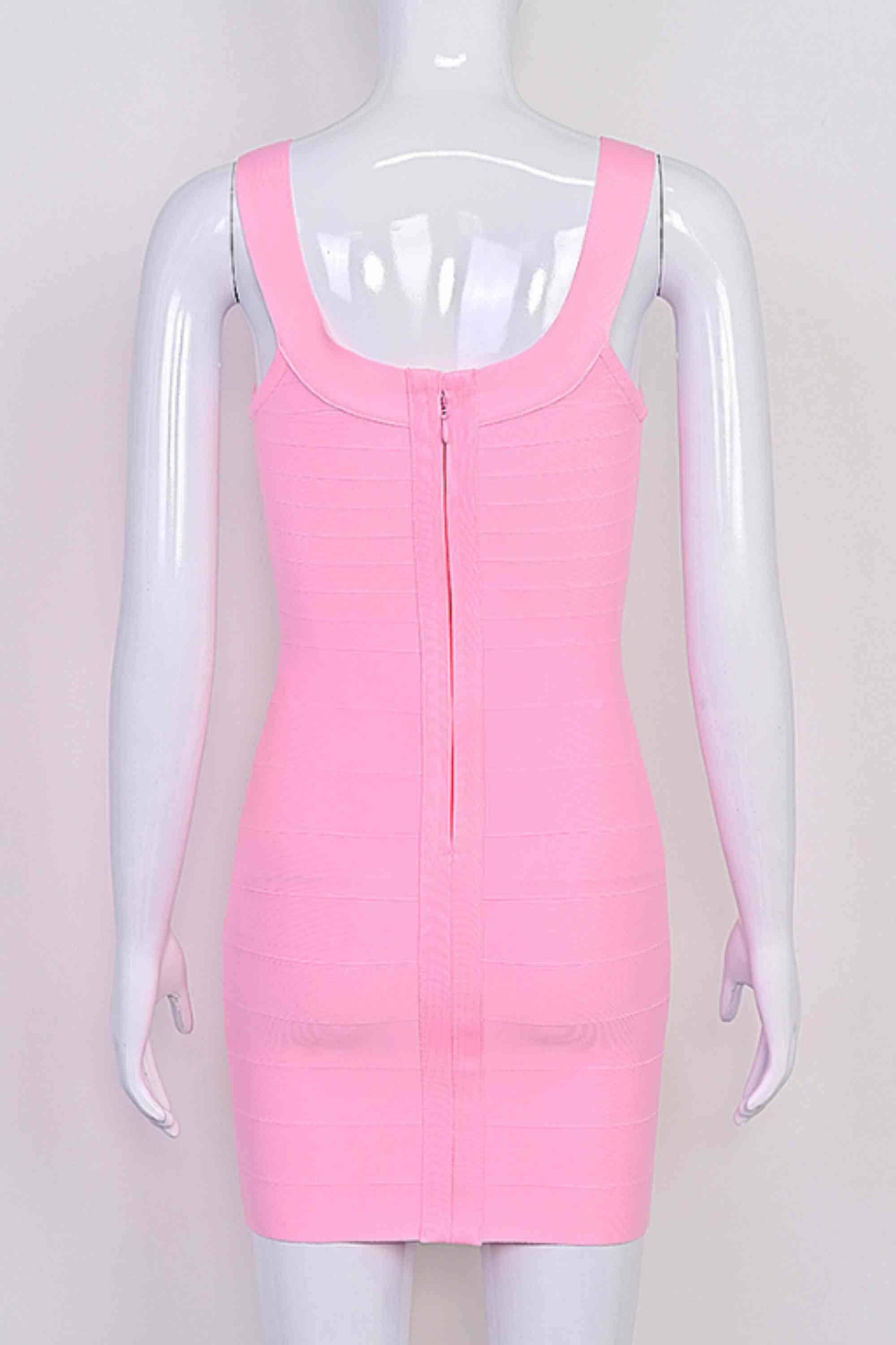 Woman wearing a figure flattering Cindy Bandage Mini Dress - Blush Pink BODYCON COLLECTION Pty Ltd