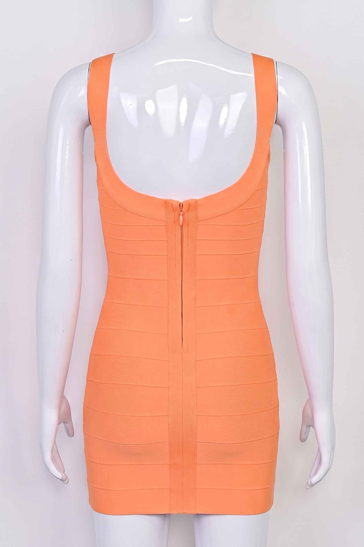 Woman wearing a figure flattering Cindy Bandage Mini Dress - Coral BODYCON COLLECTION Pty Ltd