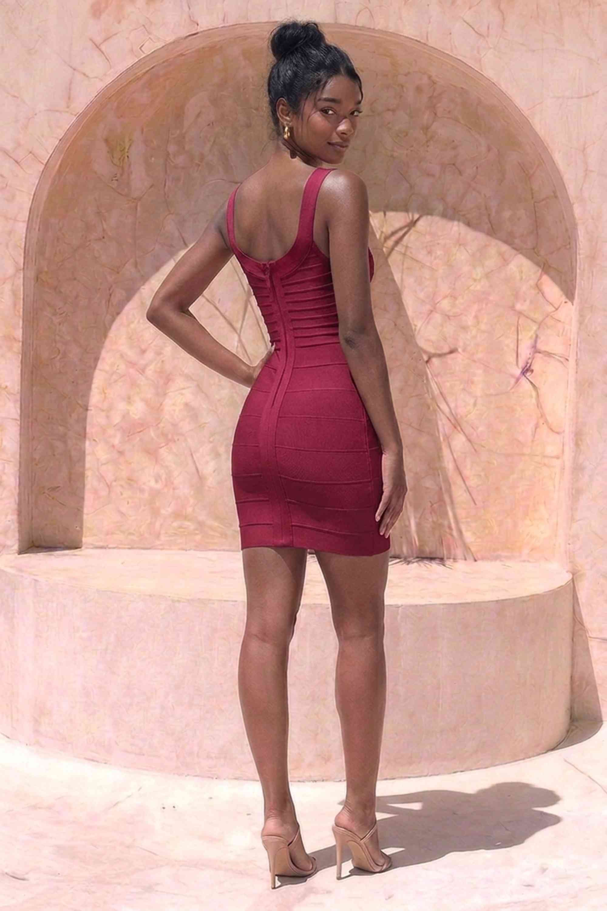 Woman wearing a figure flattering Cindy Bandage Mini Dress - Red Wine BODYCON COLLECTION Pty Ltd