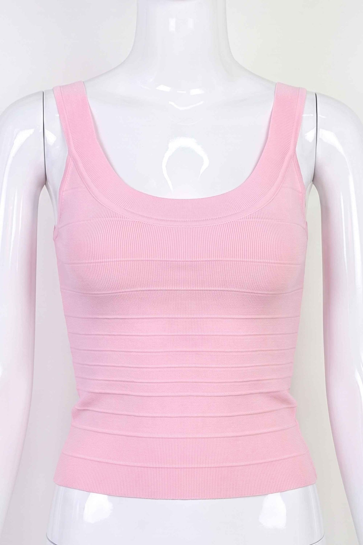 Woman wearing a figure flattering Cindy Bandage Top - Dusty Pink BODYCON COLLECTION Pty Ltd
