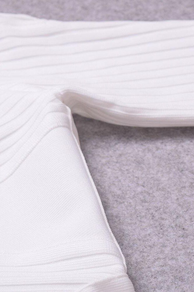 Woman wearing a figure flattering Coco Long Sleeve Bandage Dress - Pearl White BODYCON COLLECTION