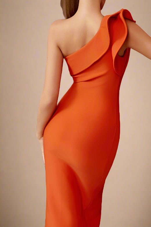 Woman wearing a figure flattering  Daphne Bodycon Dress - Apricot Orange BODYCON COLLECTION
