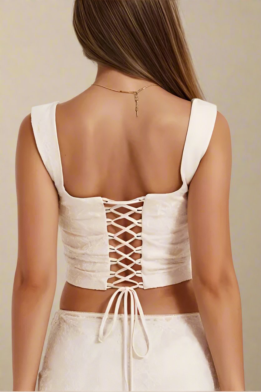 Woman wearing a figure flattering Darling Corset Crop Top - Ivory BODYCON COLLECTION