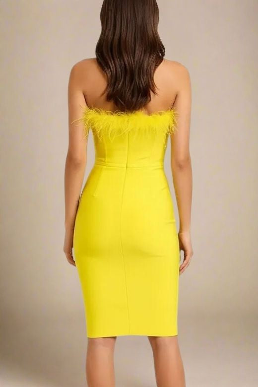 Woman wearing a figure flattering Erin Bodycon Dress - Sun Yellow BODYCON COLLECTION