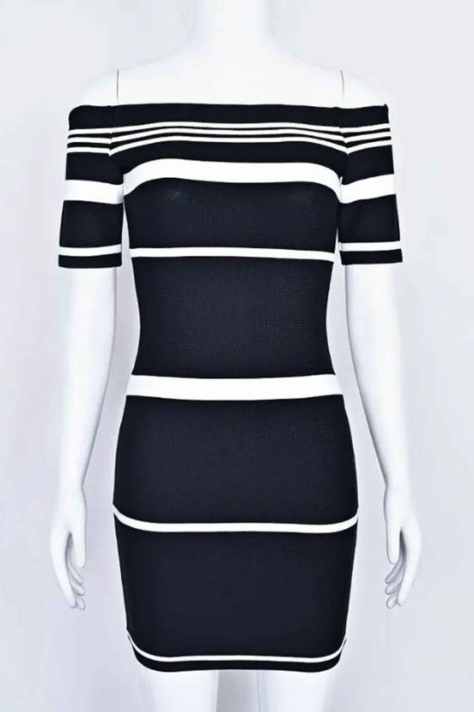 Woman wearing a figure flattering Evelyn Bandage Mini Dress - Classic Black BODYCON COLLECTION Pty Ltd
