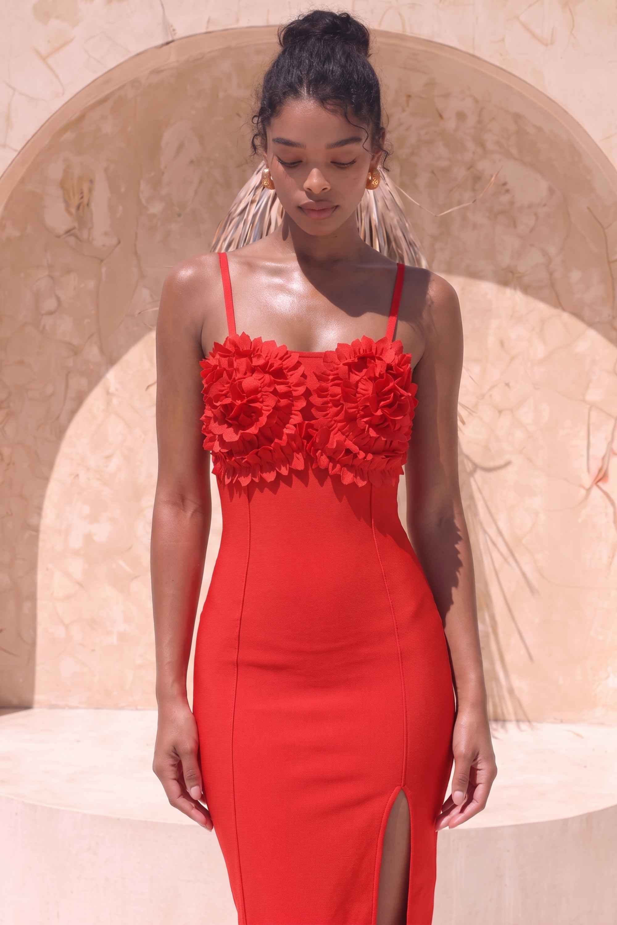 Woman wearing a figure flattering Faye Bandage Midi Dress - Lipstick Red BODYCON COLLECTION
