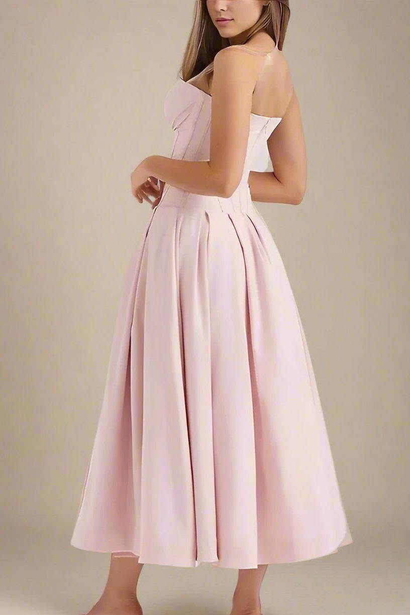 Woman wearing a figure flattering Gabbi Bodycon Midi Dress - Dusty Pink BODYCON COLLECTION