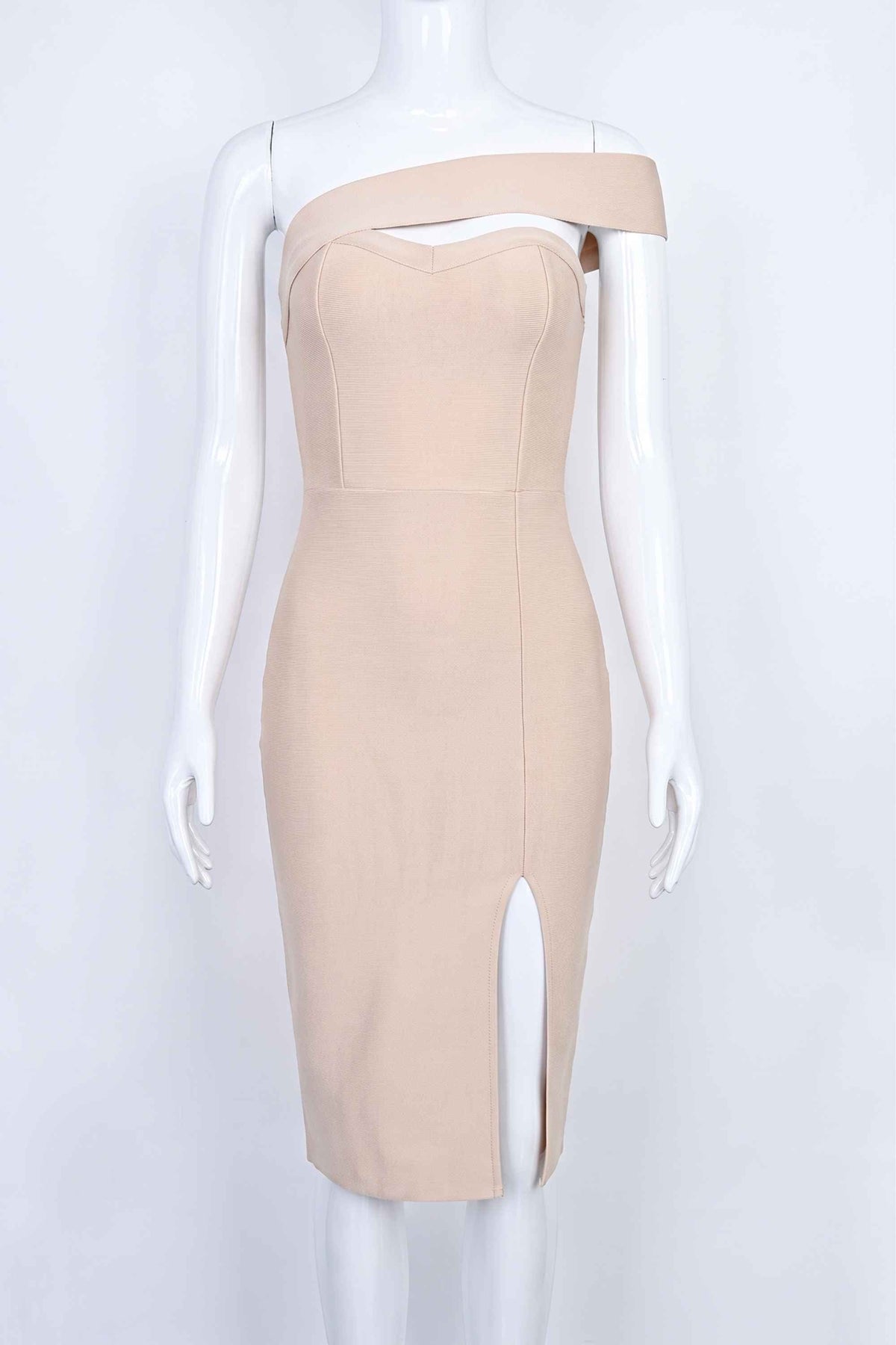 Woman wearing a figure flattering Gianna Bandage Dress - Nude BODYCON COLLECTION