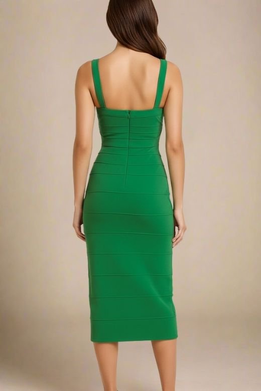 Woman wearing a figure flattering Heidi Bandage Midi Dress - Emerald Green Bodycon Collection