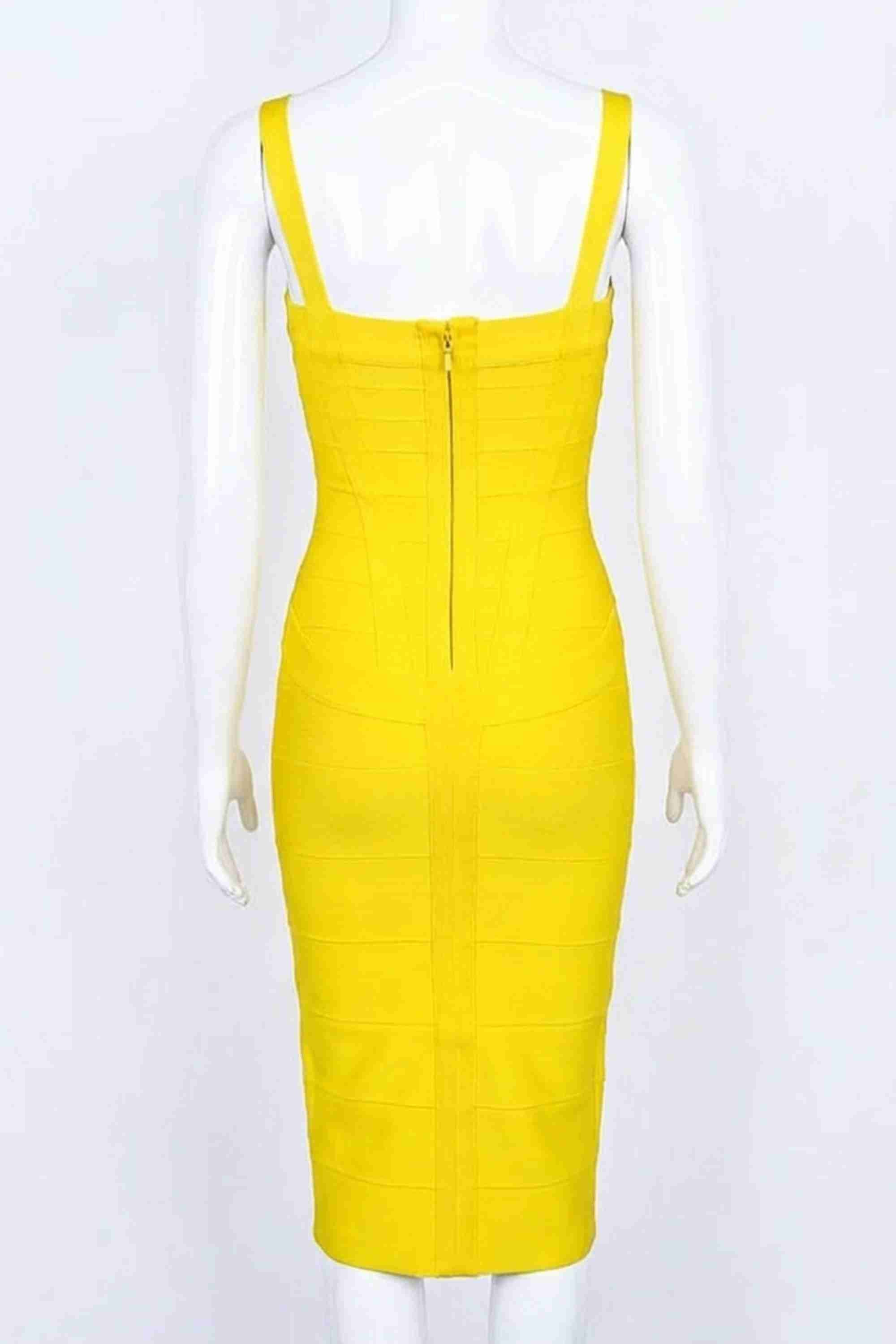 Woman wearing a figure flattering Heidi Bandage Midi Dress - Sun Yellow Bodycon Collection