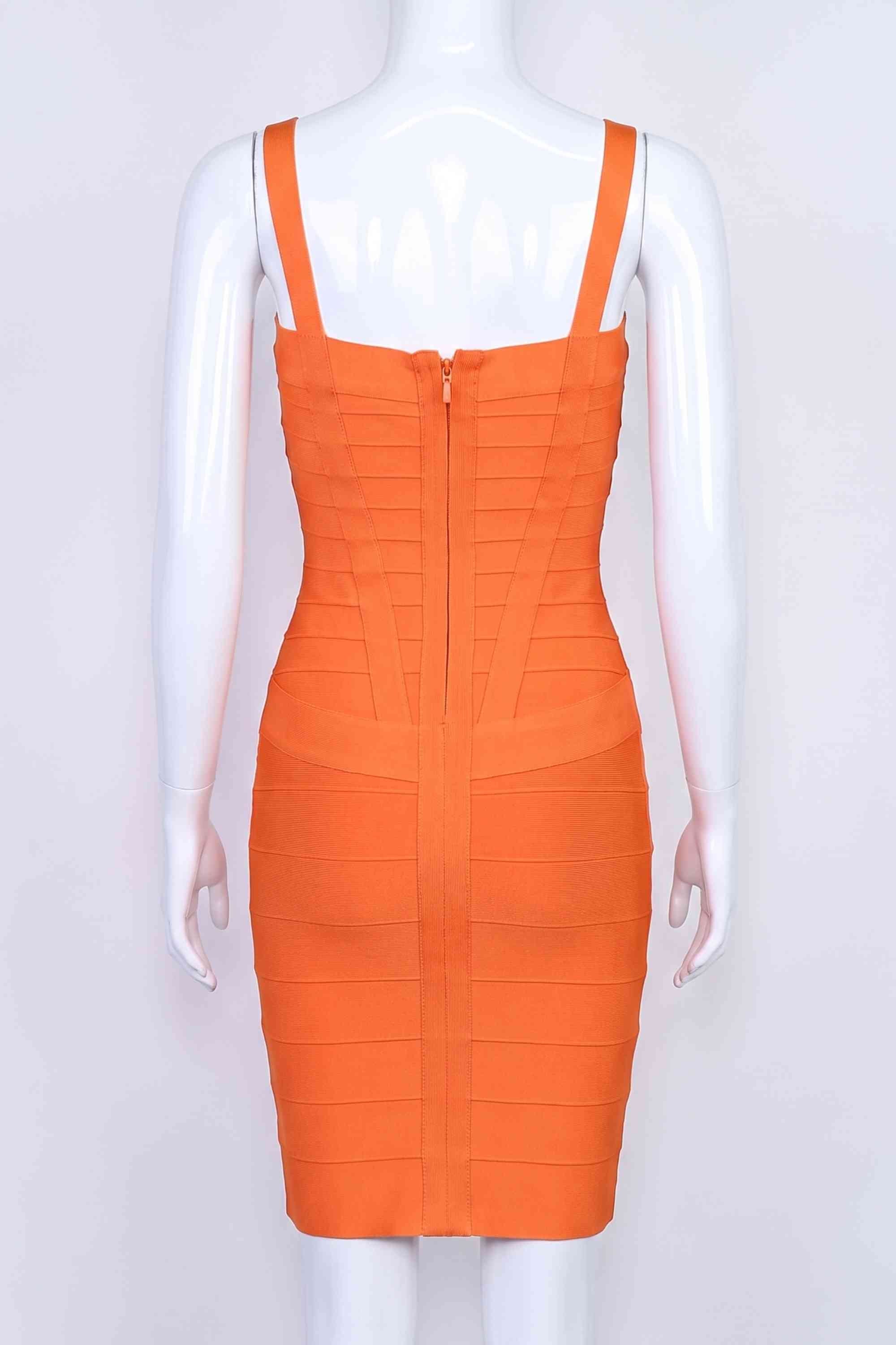 Woman wearing a figure flattering Heidi Bandage Mini Dress - Apricot Orange Bodycon Collection