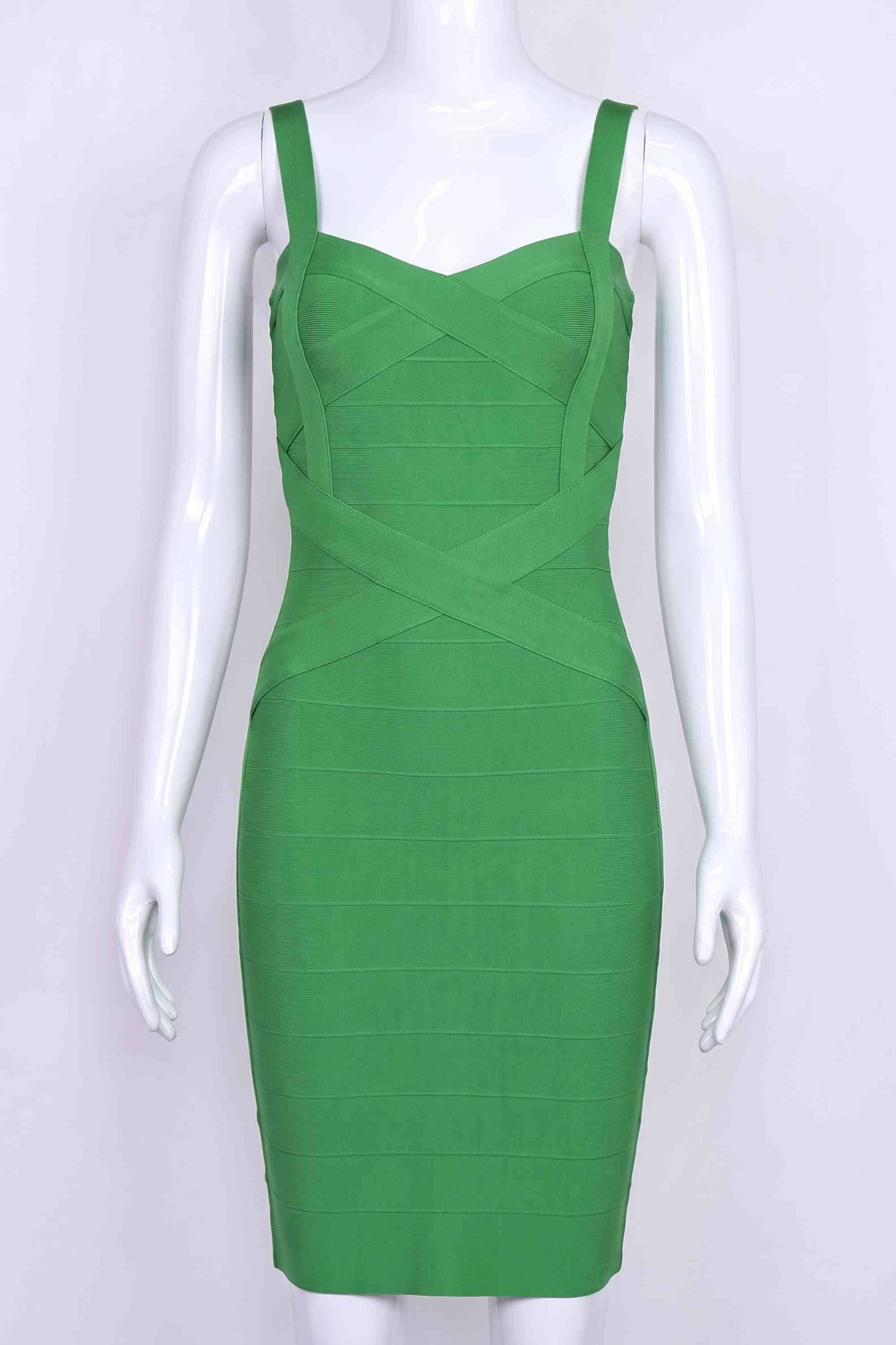 Woman wearing a figure flattering Heidi Bandage Mini Dress - Emerald Green Bodycon Collection