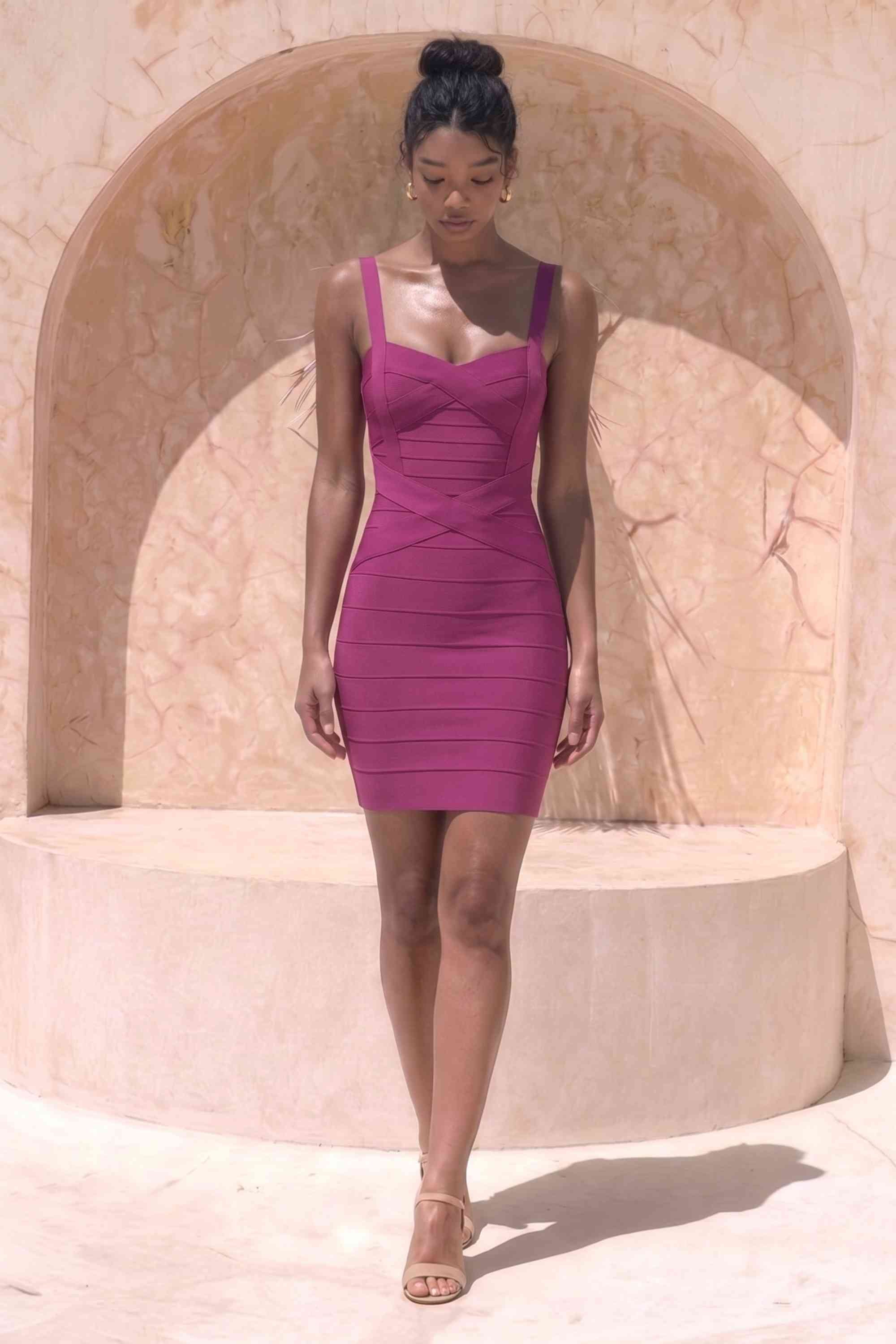 Woman wearing a figure flattering Heidi Bandage Mini Dress - Magenta Pink Bodycon Collection