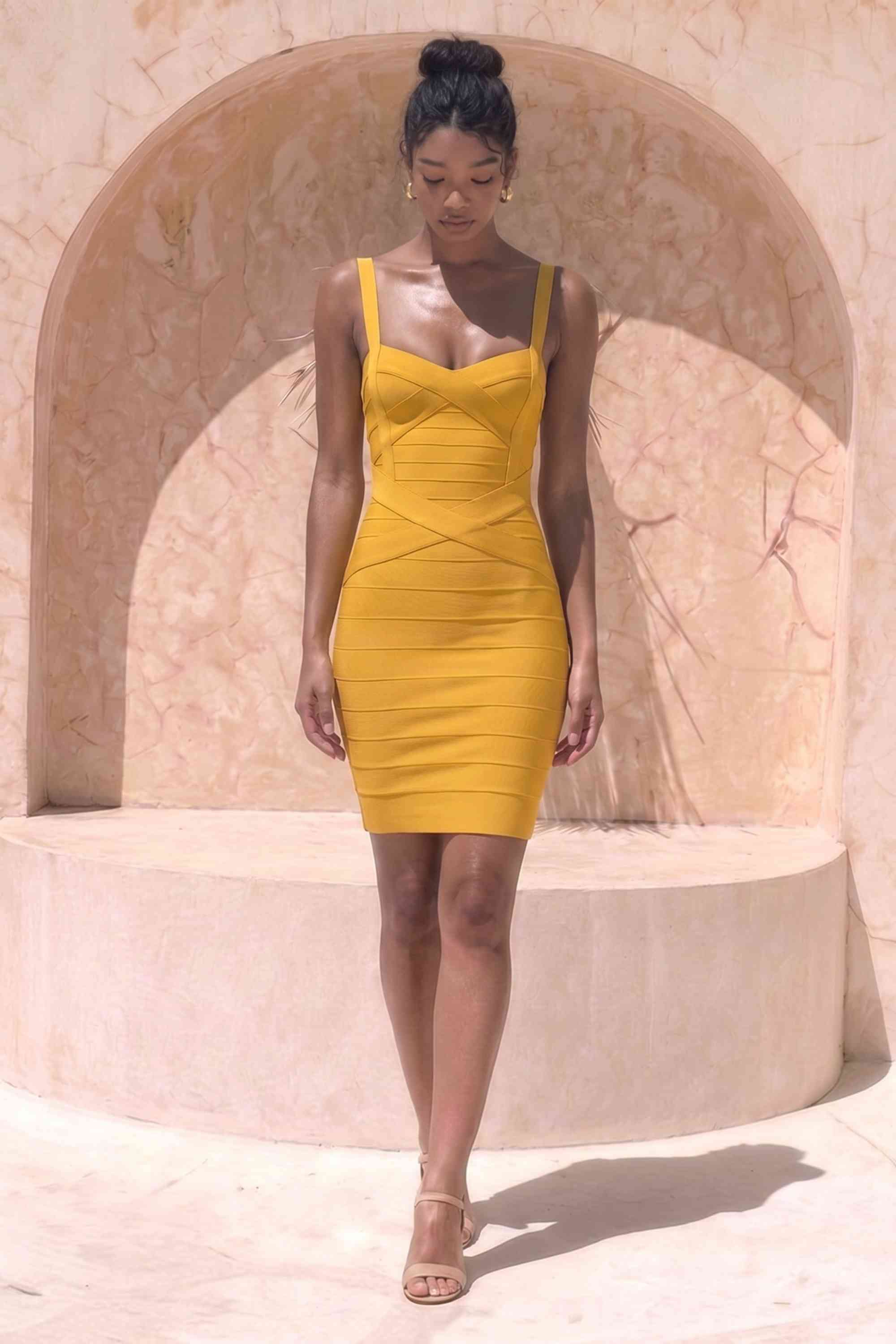 Woman wearing a figure flattering Heidi Bandage Mini Dress - Mustard Yellow Bodycon Collection