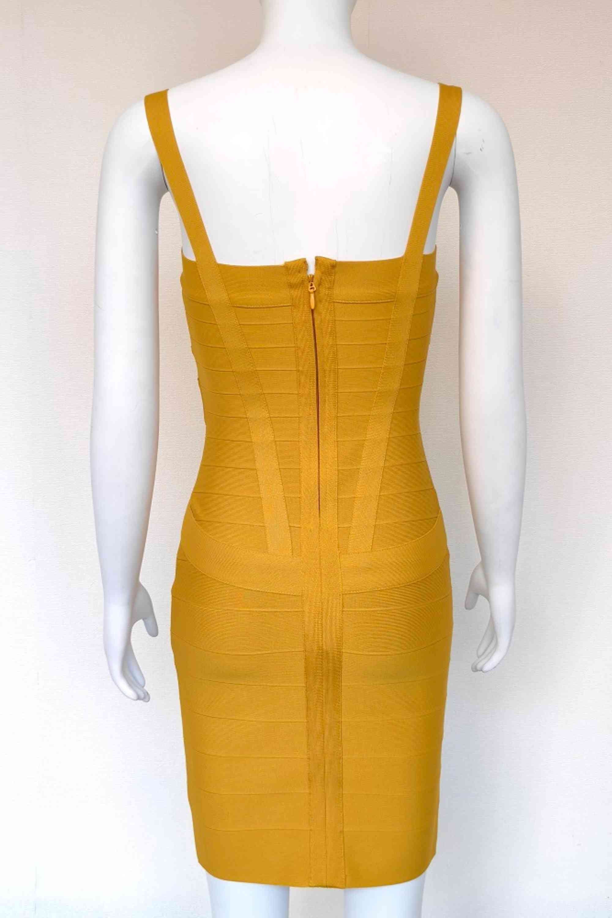Woman wearing a figure flattering Heidi Bandage Mini Dress - Mustard Yellow Bodycon Collection