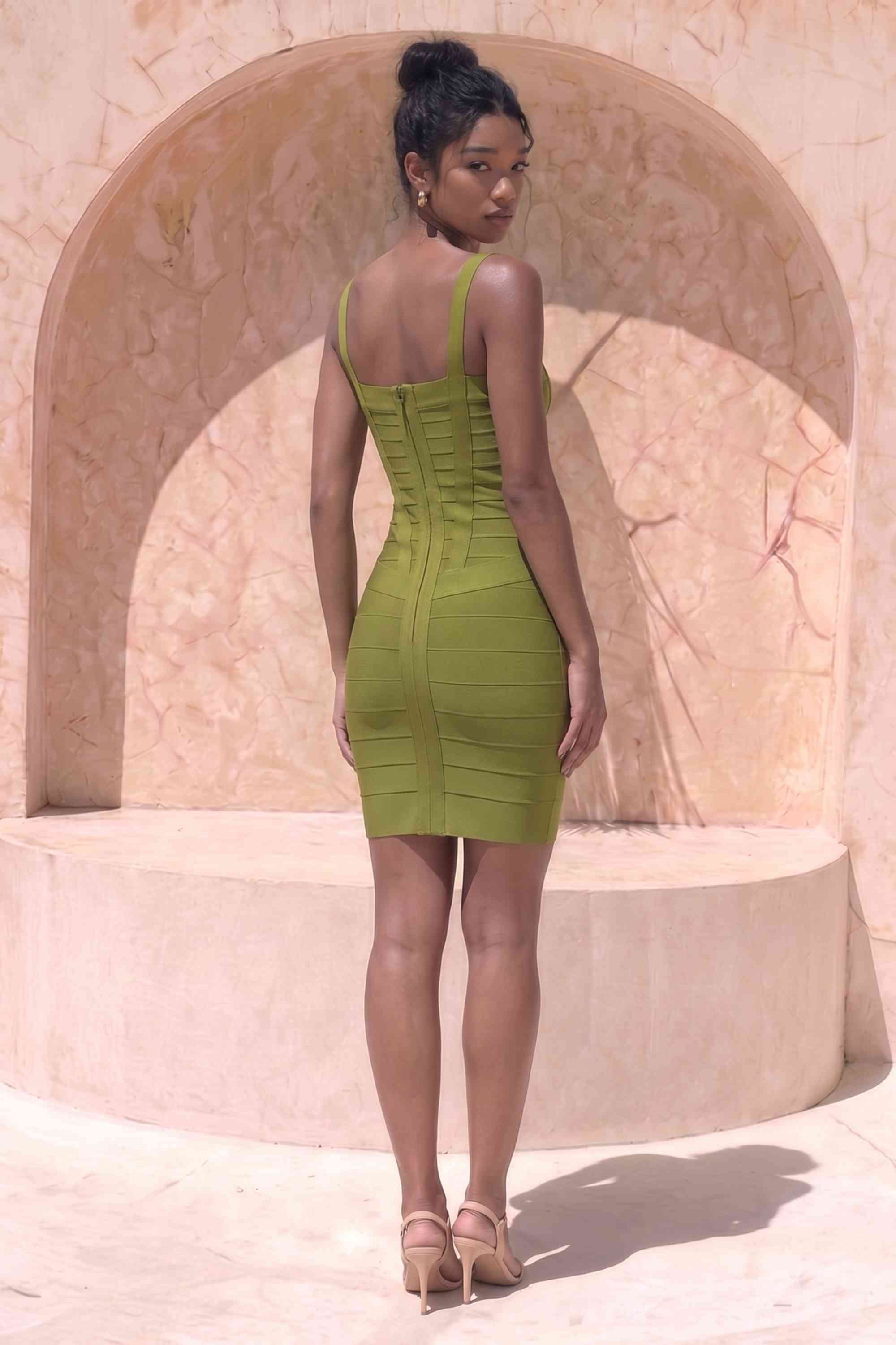 Woman wearing a figure flattering Heidi Bandage Mini Dress - Olive Green Bodycon Collection