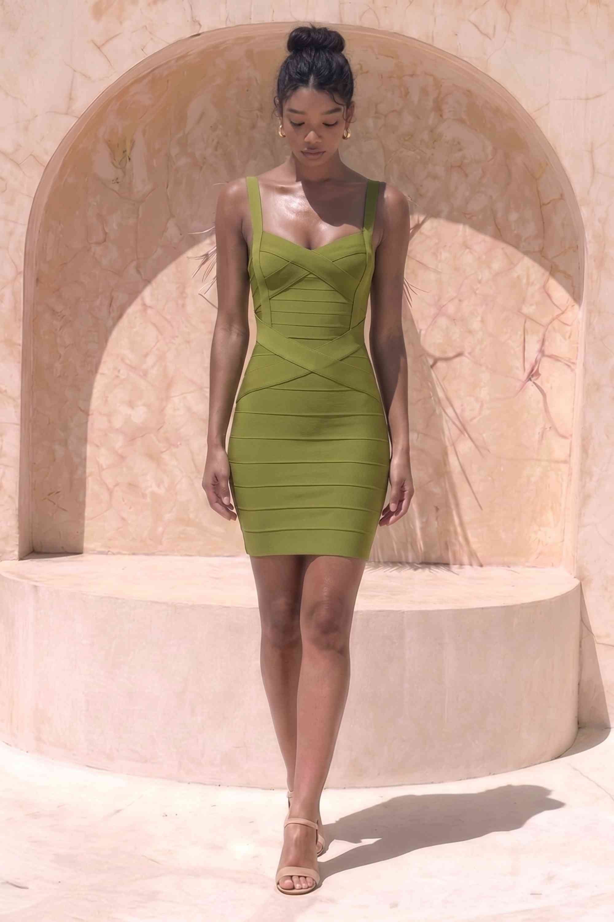 Woman wearing a figure flattering Heidi Bandage Mini Dress - Olive Green Bodycon Collection