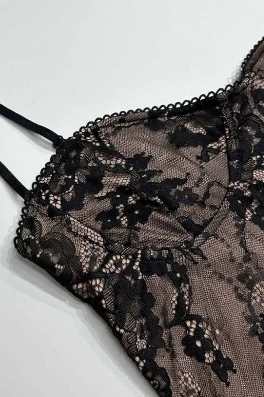 Woman wearing a figure flattering Joan Bodycon Dress - Classic Black BODYCON COLLECTION