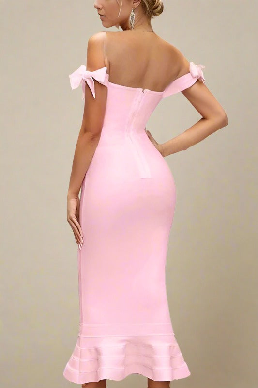 Woman wearing a figure flattering  Hunter Bandage Midi Dress - Dusty Pink BODYCON COLLECTION