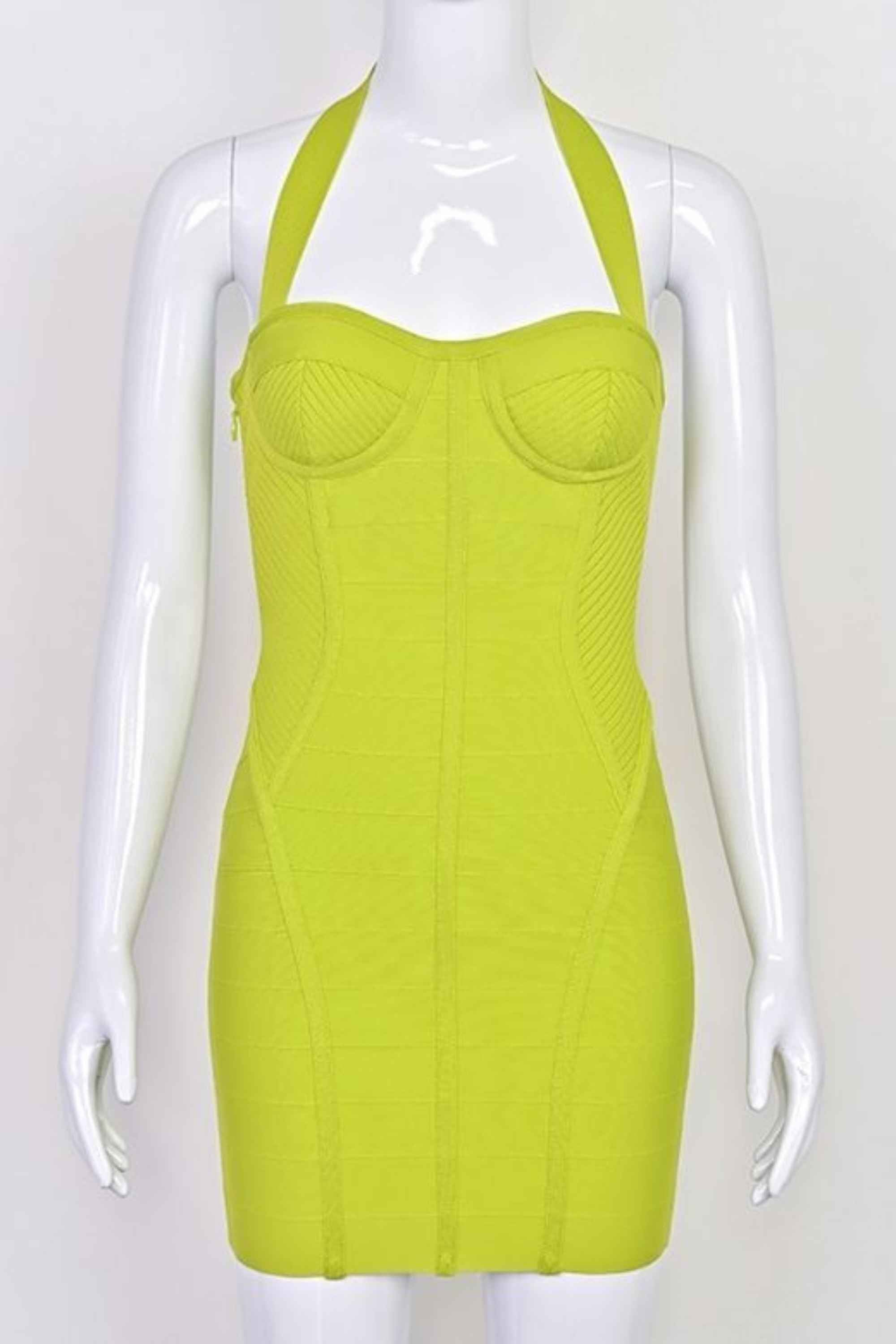 Woman wearing a figure flattering Isabella Bandage Mini Dress - Neon Green BODYCON COLLECTION Pty Ltd