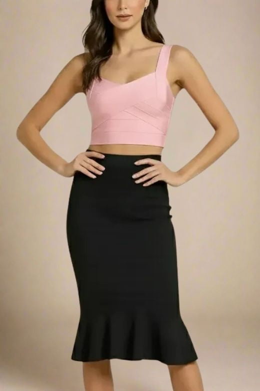 Woman wearing a figure flattering Jay Bandage Crop Top - Dusty Pink BODYCON COLLECTION