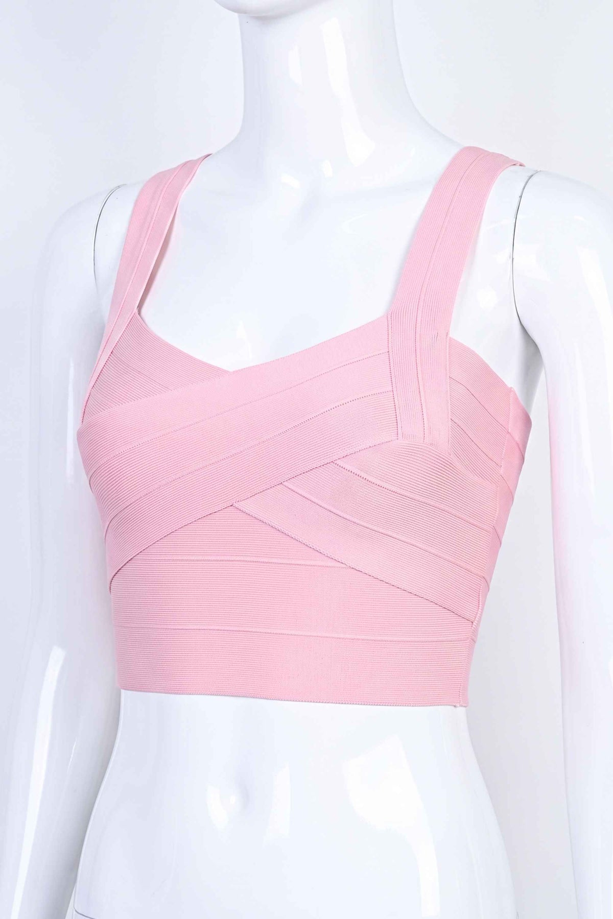 Woman wearing a figure flattering Jay Bandage Crop Top - Dusty Pink BODYCON COLLECTION