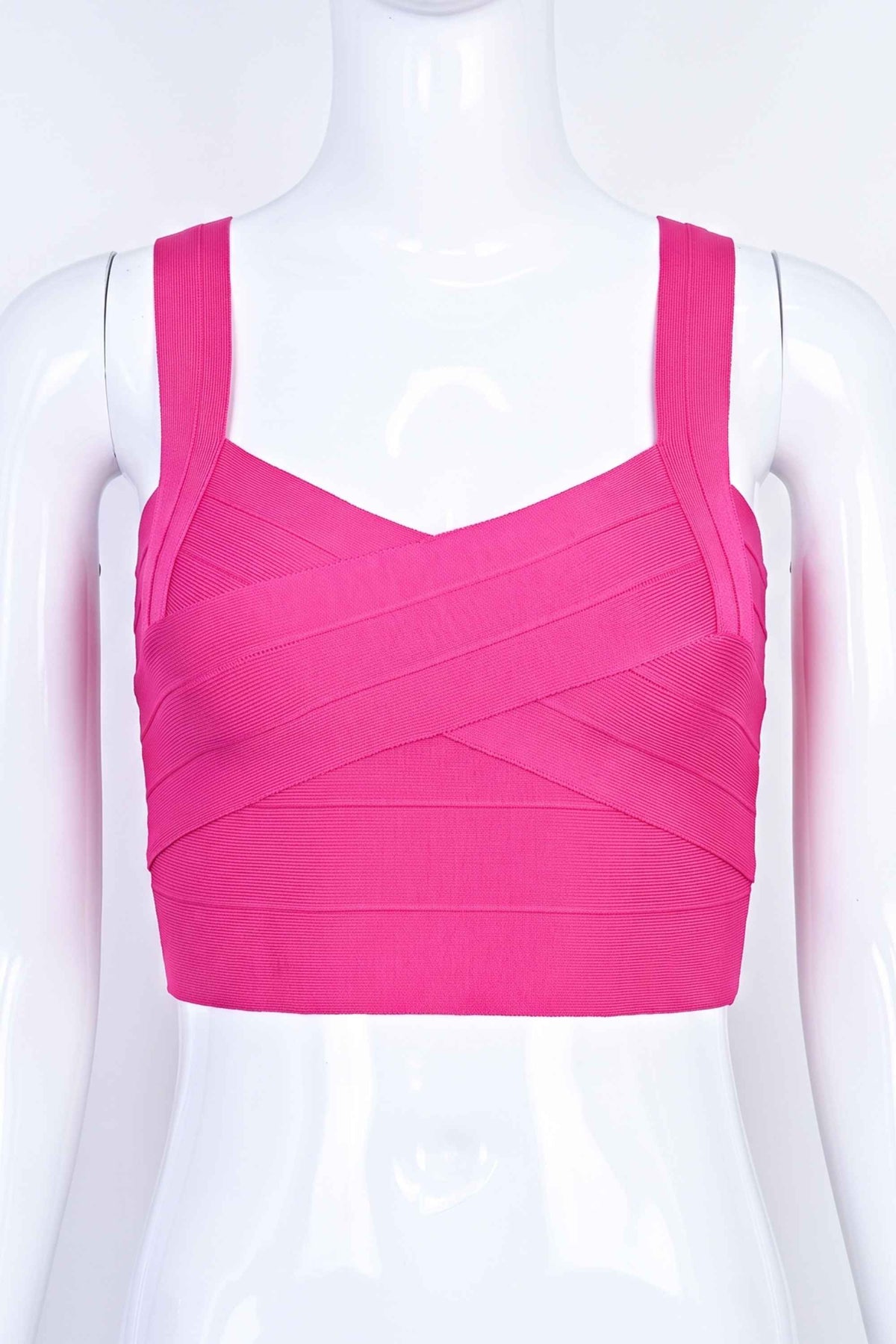 Woman wearing a figure flattering Jay Bandage Crop Top - Hot Pink BODYCON COLLECTION