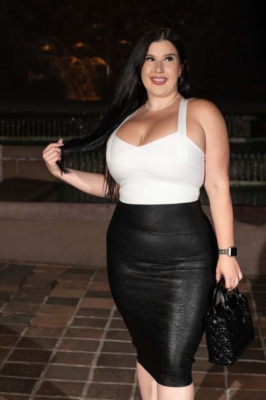 Woman wearing a figure flattering Jay Bandage Crop Top - Violet Purple BODYCON COLLECTION